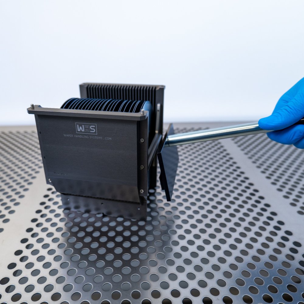 Hand attaching the detachable cassette handle to a 6 inch WHS-M1 metal cassette in a cleanroom