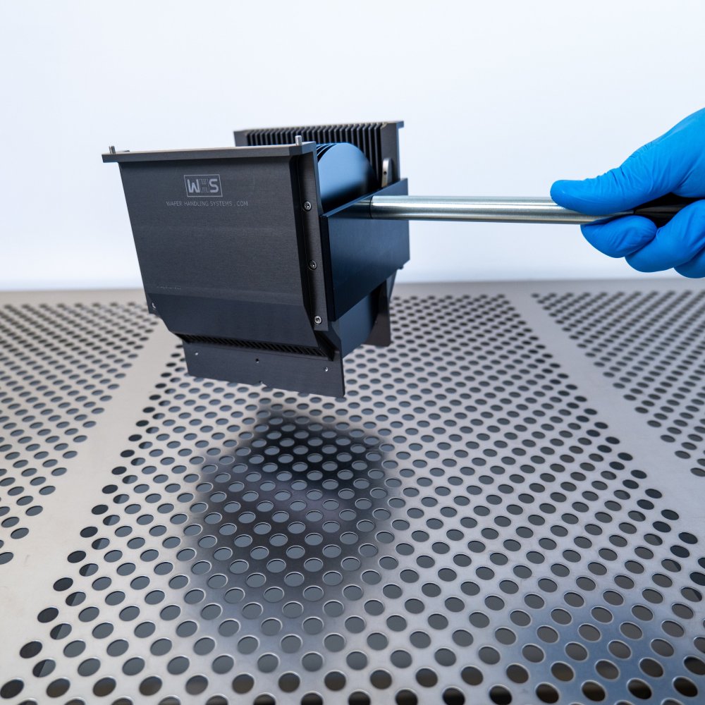 Hand using the detachable cassette handle to pick up a 6 inch WHS-M1 metal cassette