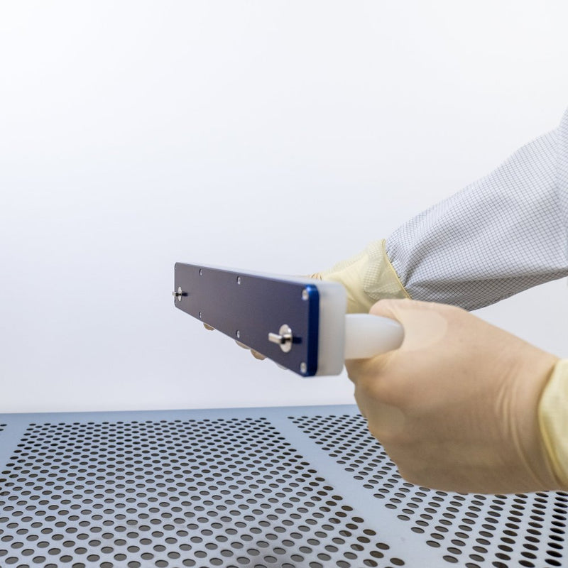 Side view of a WHS manual eFOUP and eFOSB opener while it is being held in a cleanroom