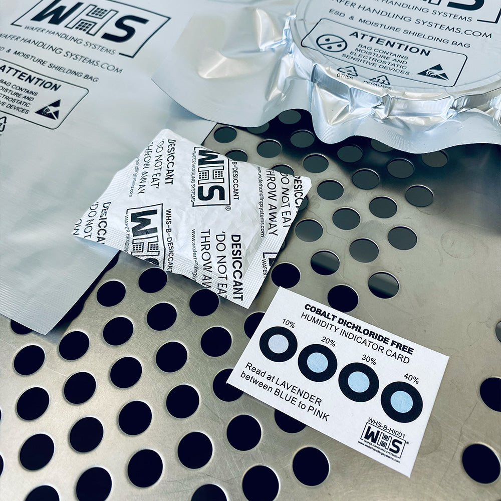 Desiccant packets and humidity indicator cards on a cleanroom table