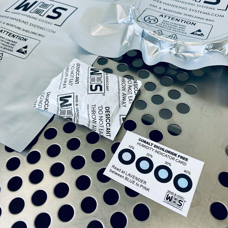 Desiccant packets and humidity indicator cards on a cleanroom table