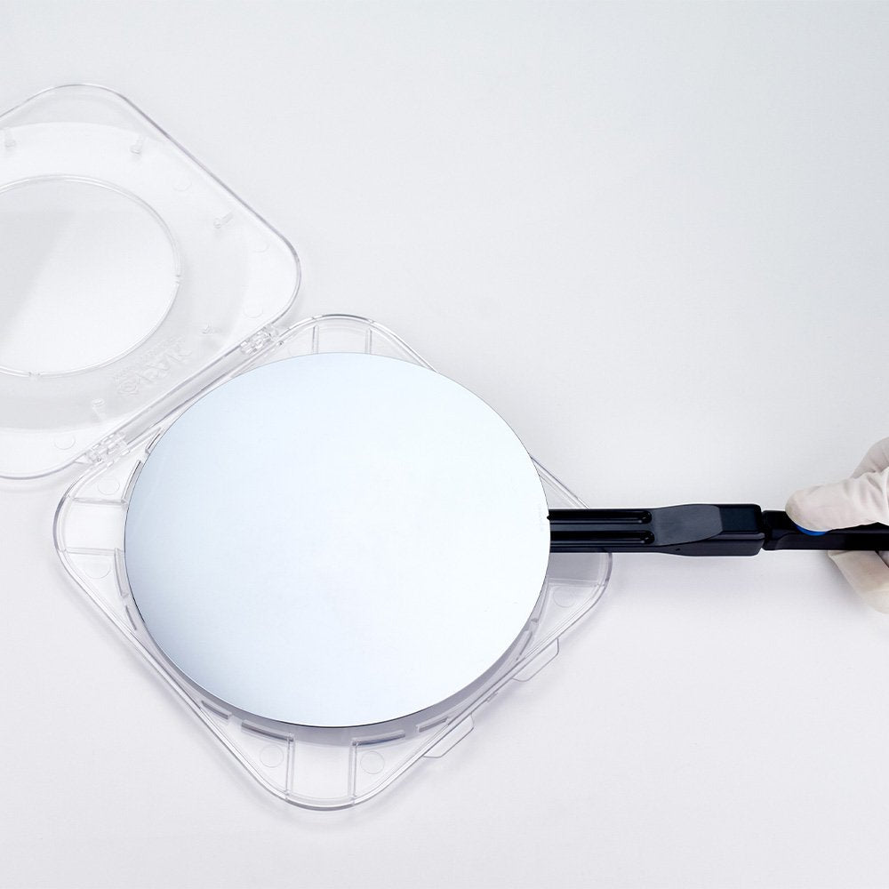 8 inch semiconductor wafer being placed in a clear polycarbonate clamshell style hinged single wafer shipper by a WHS vacuum wand