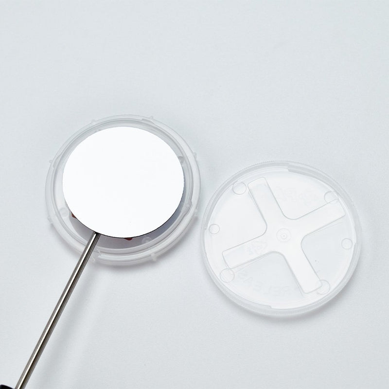 Opened coin style shipper with 1.5 inch wafer being handled by WHS Vacuum wand