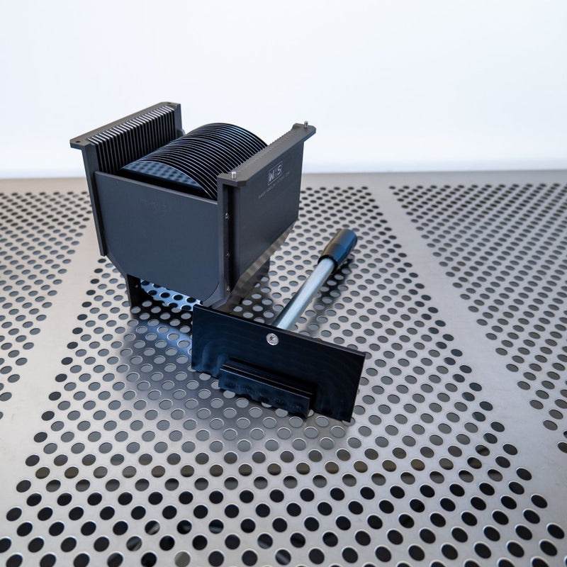 Detachable cassette handle for WHS-M1 metal cassettes laying in a cleanroom with a WHS-M1 cassette standing beside it